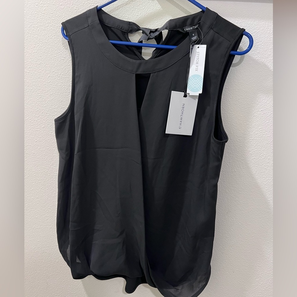 EUC black blouse.  Super cute slit in front with ribbon in back.
